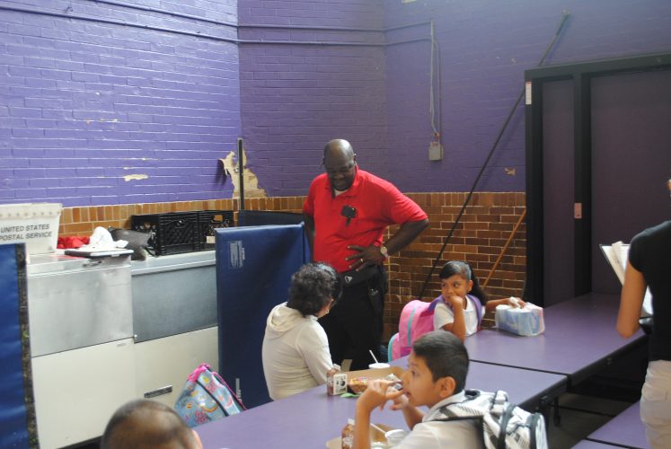 Mr. Jolly greeting the students at breakfast