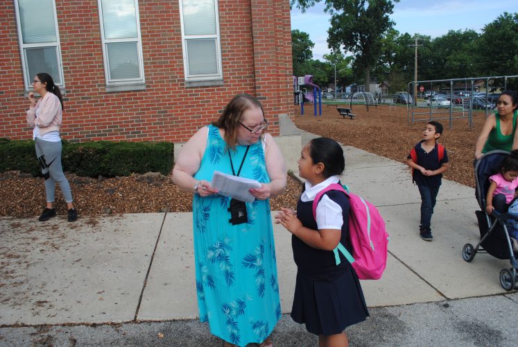 Mrs. Kent helping a student find their line.